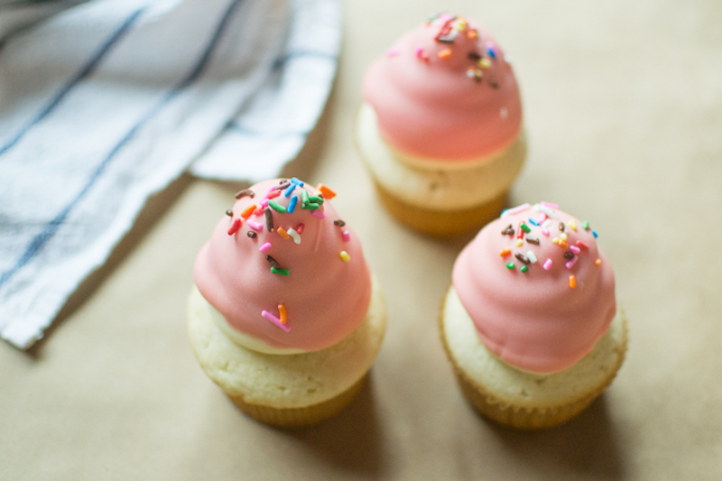 colored chocolate dipped cupcakes