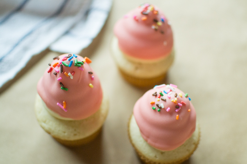 colored chocolate dipped cupcakes