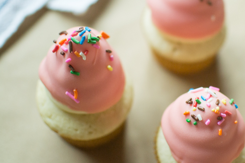 colored chocolate dipped cupcakes