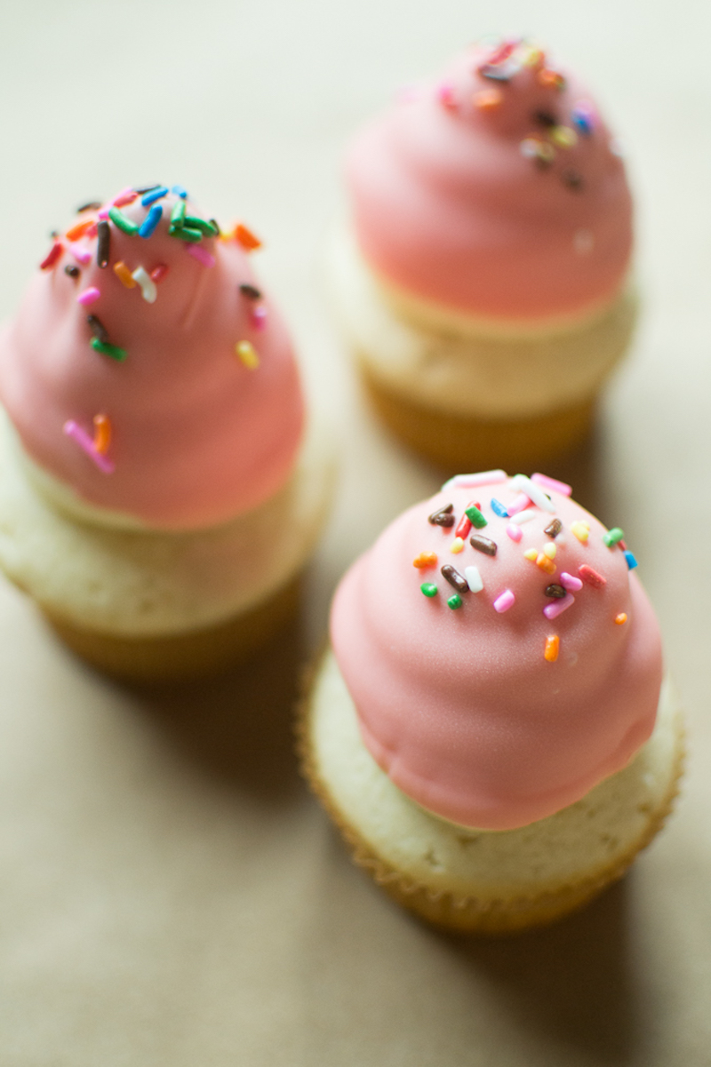 colored chocolate dipped cupcakes