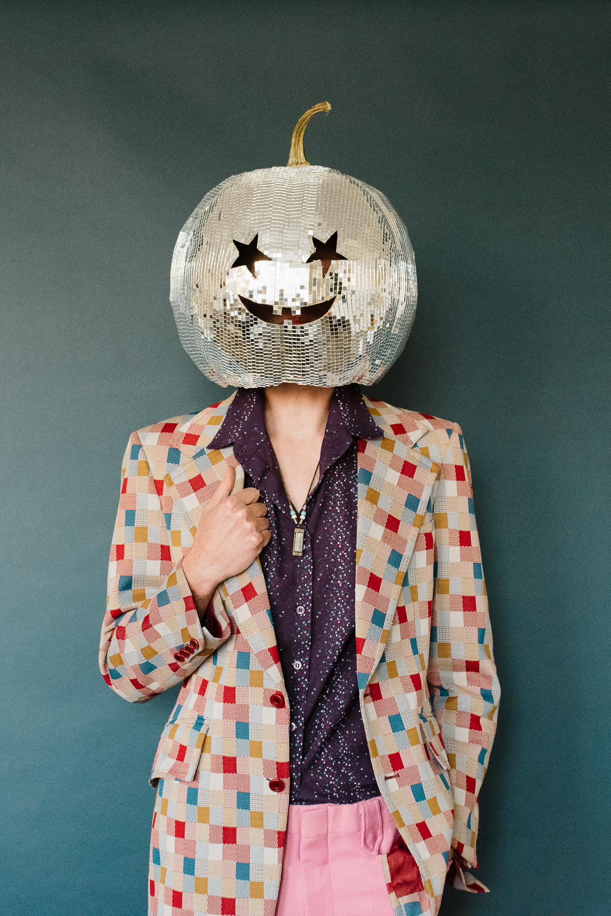 standing with diy disco pumpkin head on