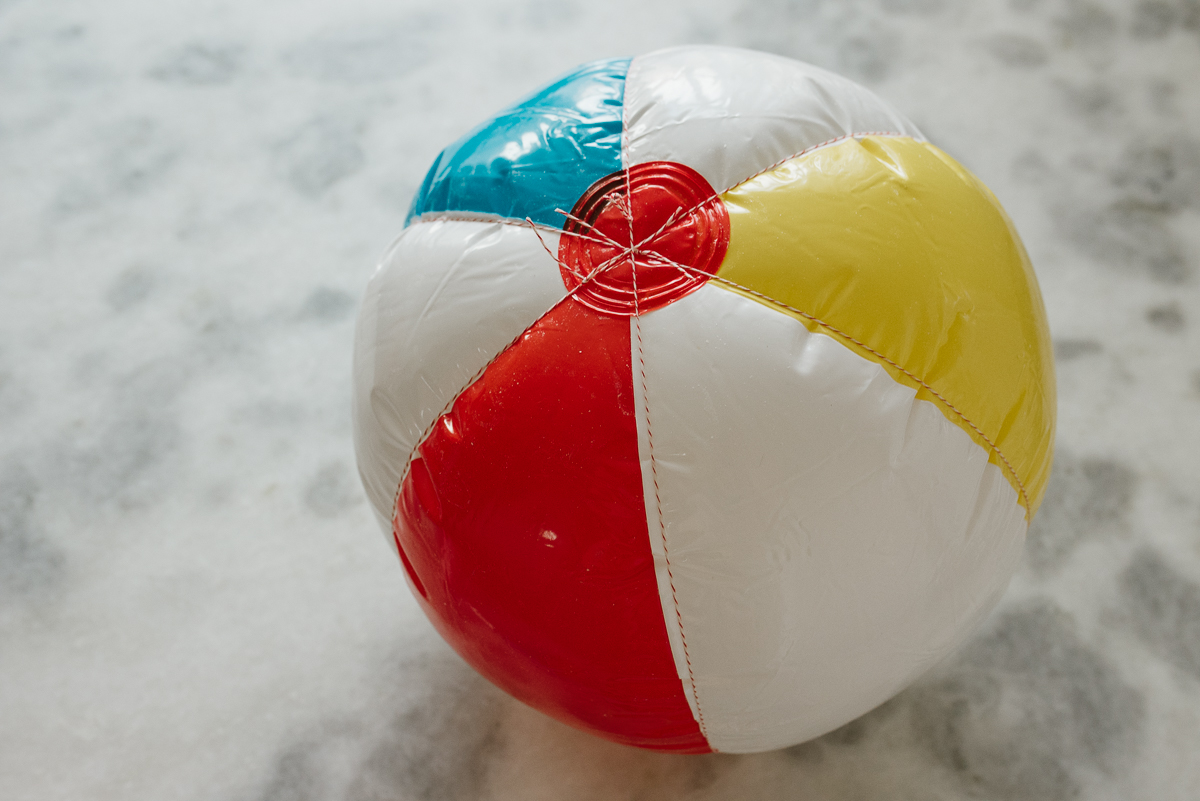 beach ball tied to look like a pumpkin